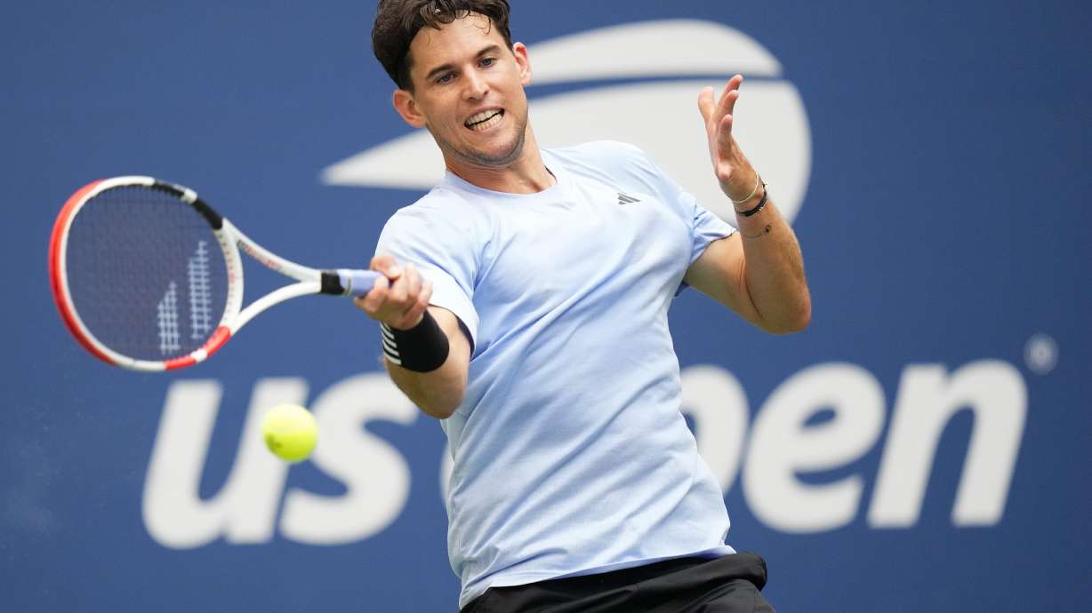 FILE - Dominic Thiem, of Austria, returns a shot to Ben Shelton, of the United States during the second round of the U.S. Open tennis championships on Aug. 30, 2023, in New York. Former U.S. Open champion Thiem had a brush with one of Australia's most venomous snakes during a qualifying match at the Brisbane International on Saturday, Dec. 30.