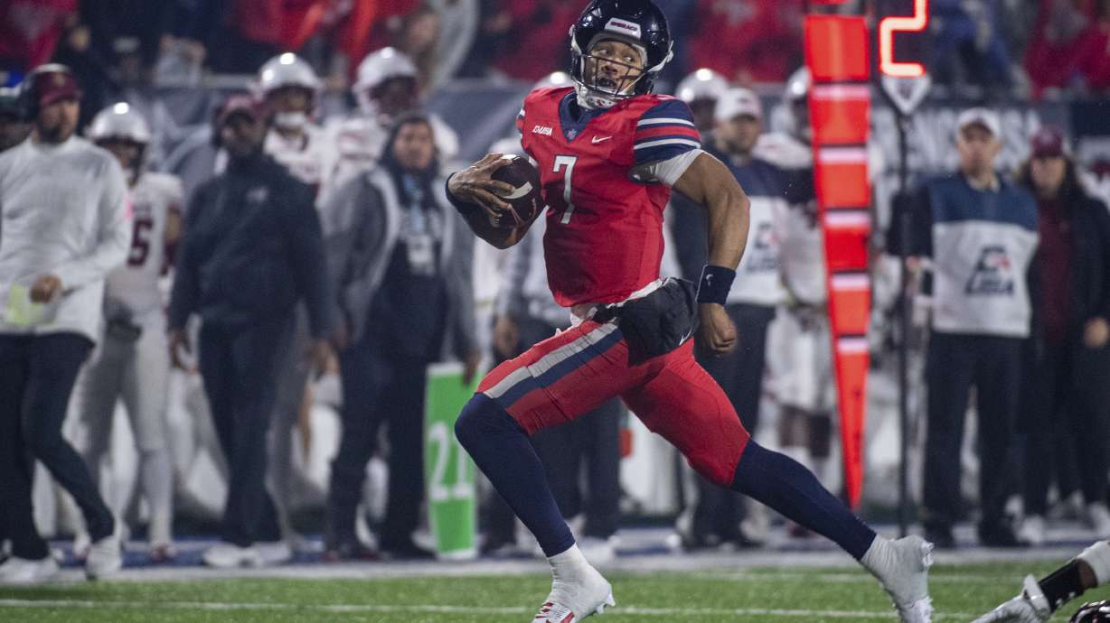 Liberty's Kaidon Salter runs for a touchdown against New Mexico State during the second half of the Conference USA championship NCAA college football game Friday, Dec. 1, 2023, in Lynchburg, Va.