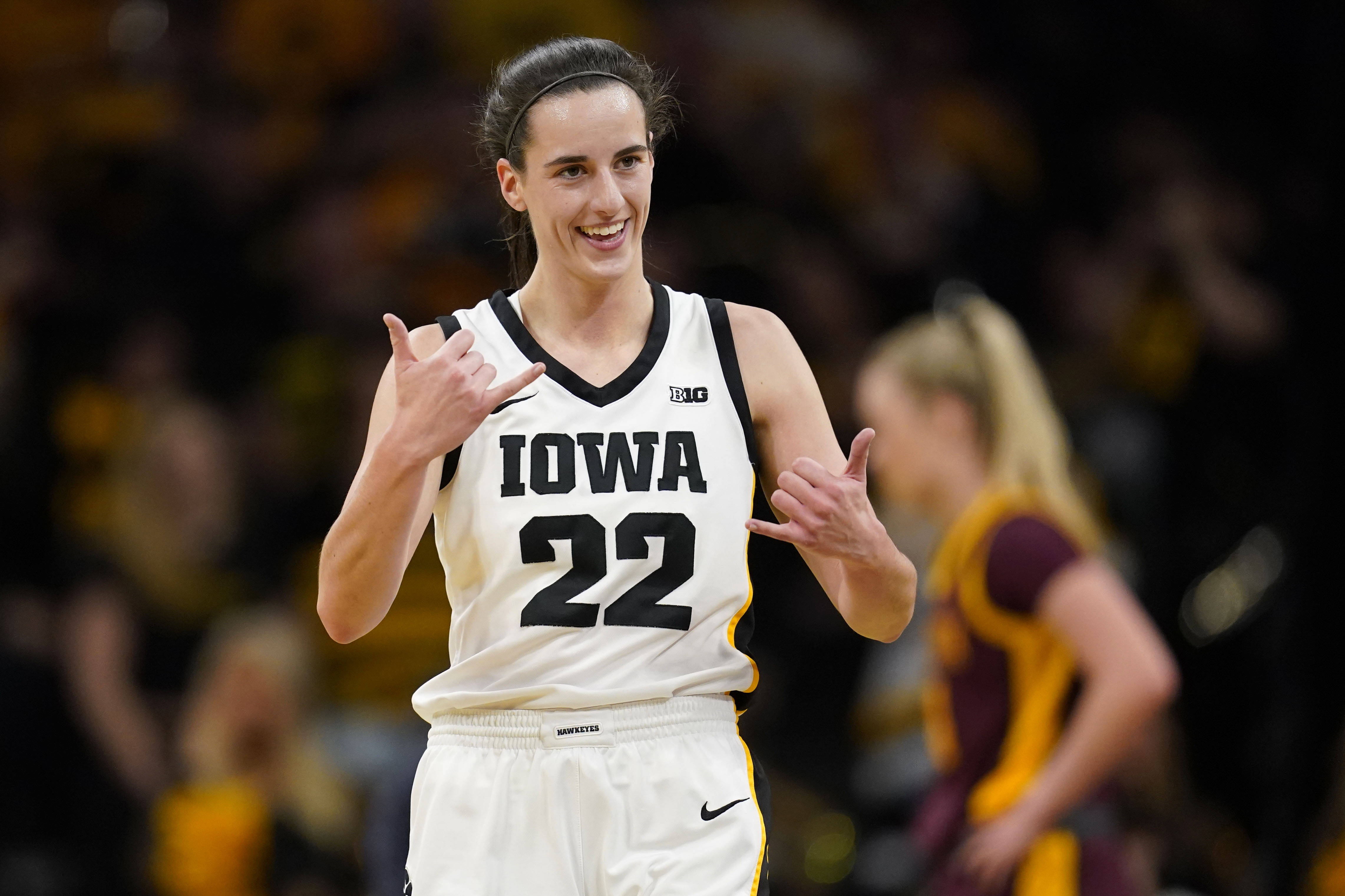 Iowa guard Caitlin Clark (22) celebrates during the first half of an NCAA college basketball game against Minnesota, Saturday, Dec. 30, 2023, in Iowa City, Iowa. 