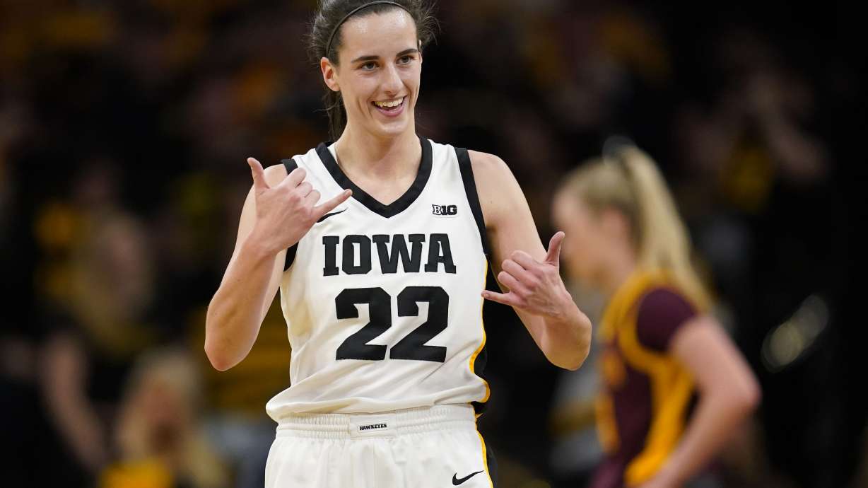Iowa guard Caitlin Clark (22) celebrates during the first half of an NCAA college basketball game against Minnesota, Saturday, Dec. 30, 2023, in Iowa City, Iowa.