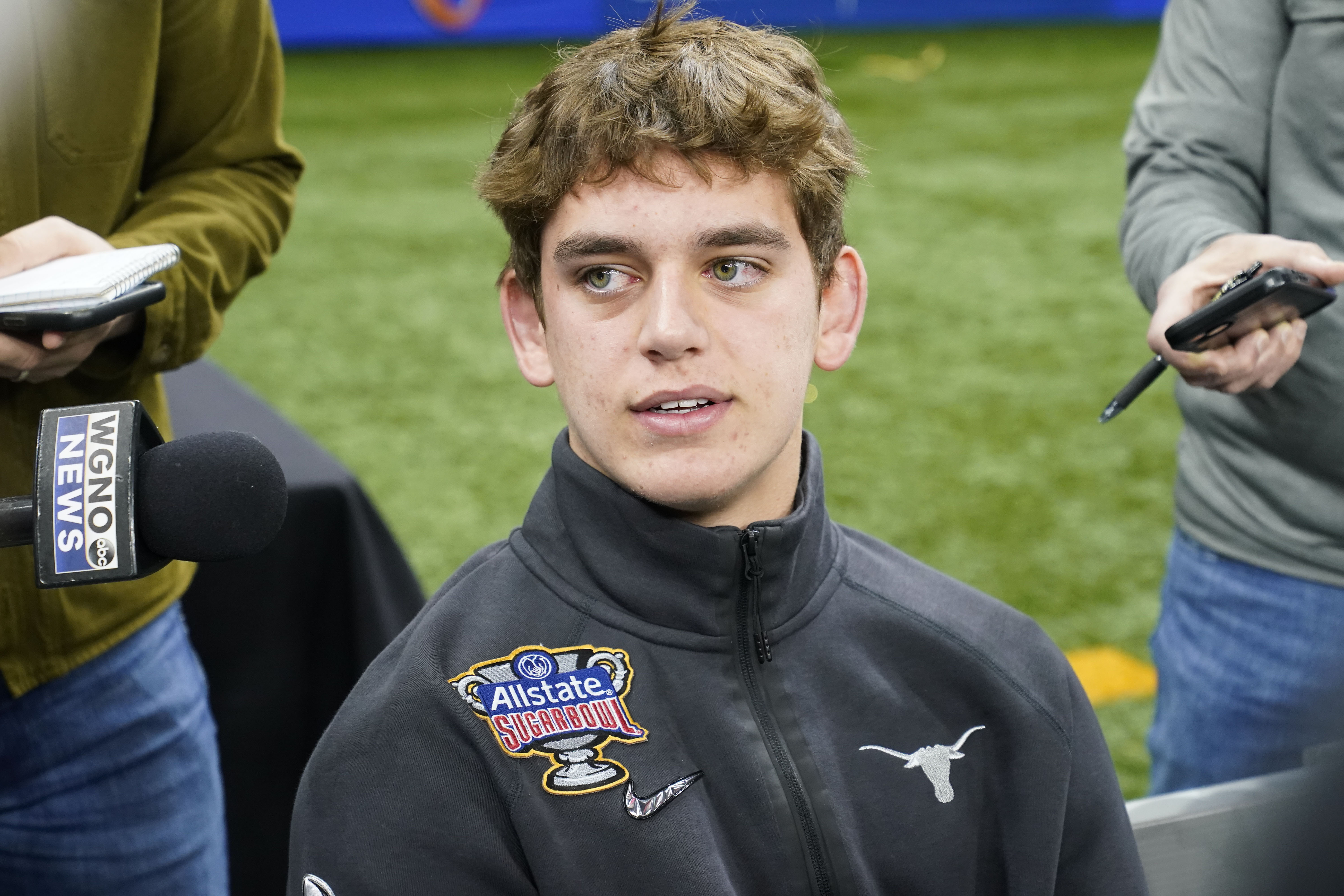 Texas quarterback Arch Manning talks to reporters during media day for the the upcoming Sugar Bowl NCAA college football semi-final game in New Orleans, Saturday, Dec. 30, 2023. 