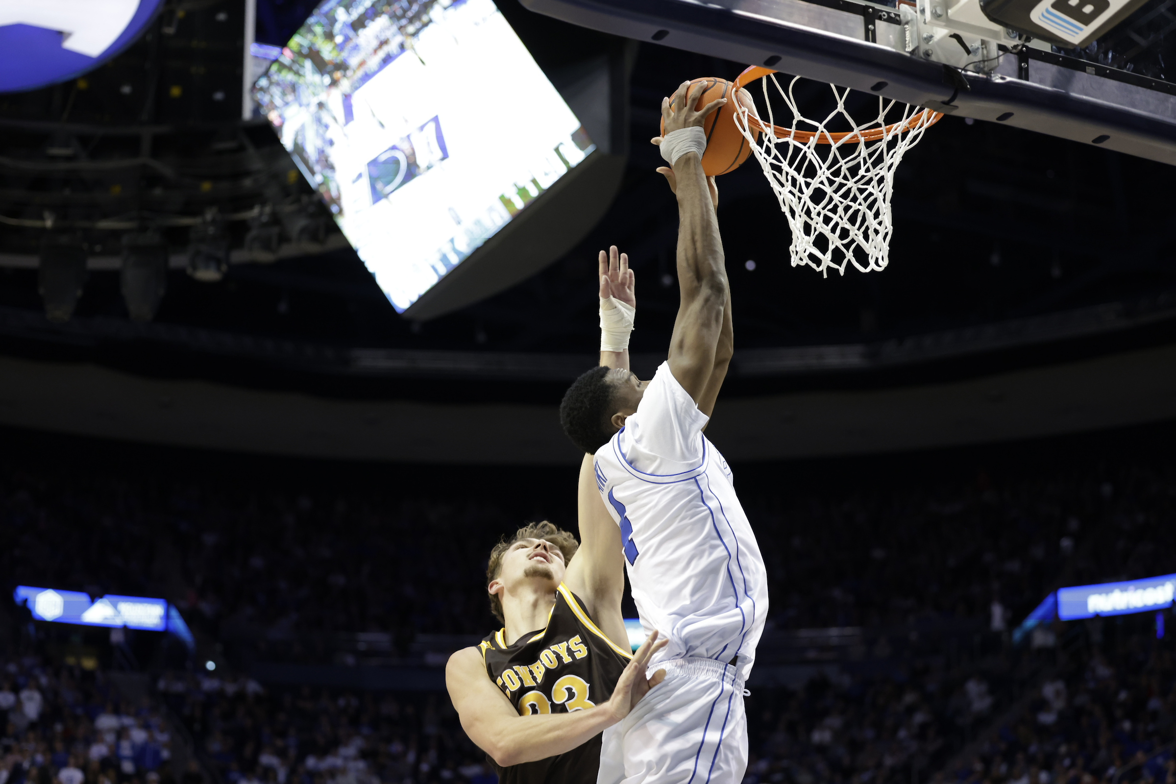 BYU post Atiki Ally Atiki goes up for a dunk against Wyoming during an NCAA men's basketball game, Saturday, Dec. 30, 2023, at the Marriott Center in Provo, Utah.