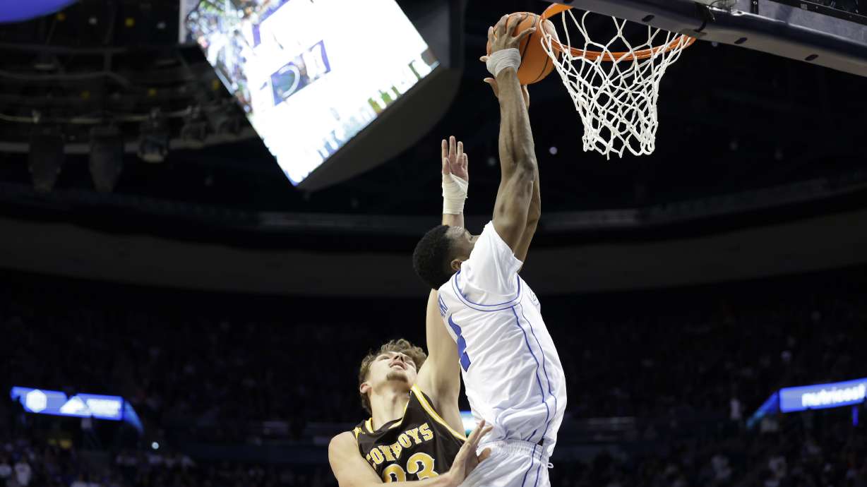 BYU post Atiki Ally Atiki goes up for a dunk against Wyoming during an NCAA men's basketball game, Saturday, Dec. 30, 2023, at the Marriott Center in Provo, Utah.