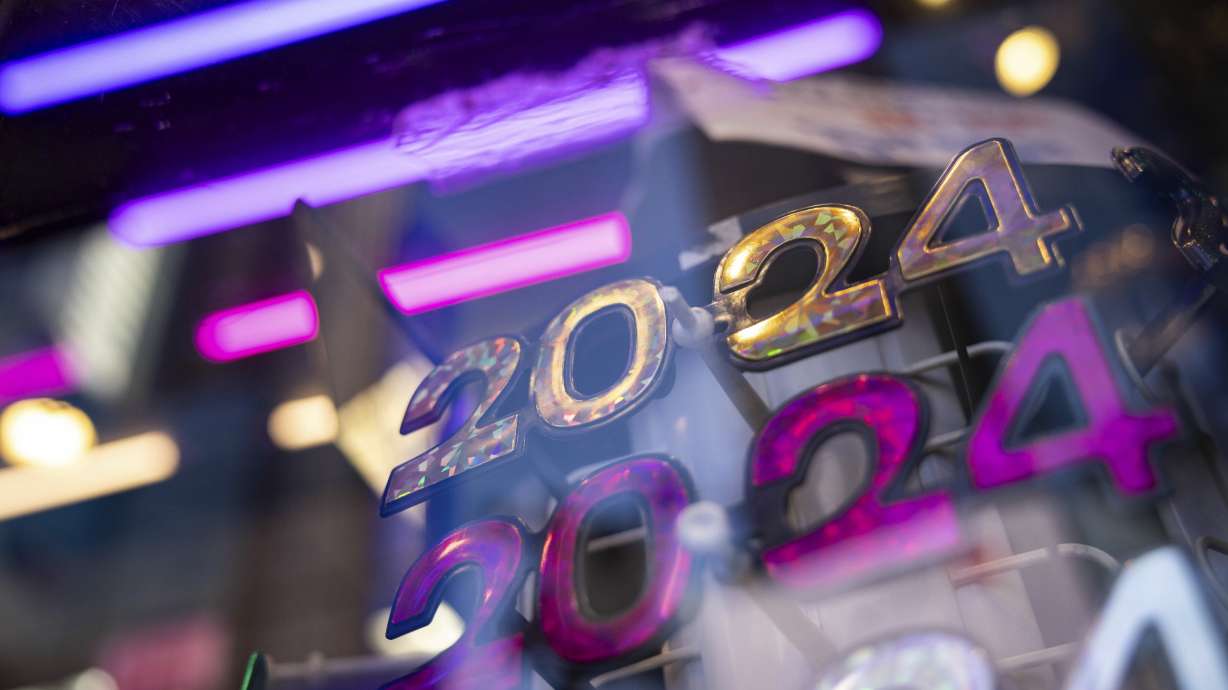 2024 glasses are displayed ahead of New Year's Eve in Times Square, Friday, in New York. One motivational teacher says resolutions don't have to be big, grandiose or overly ambitious.