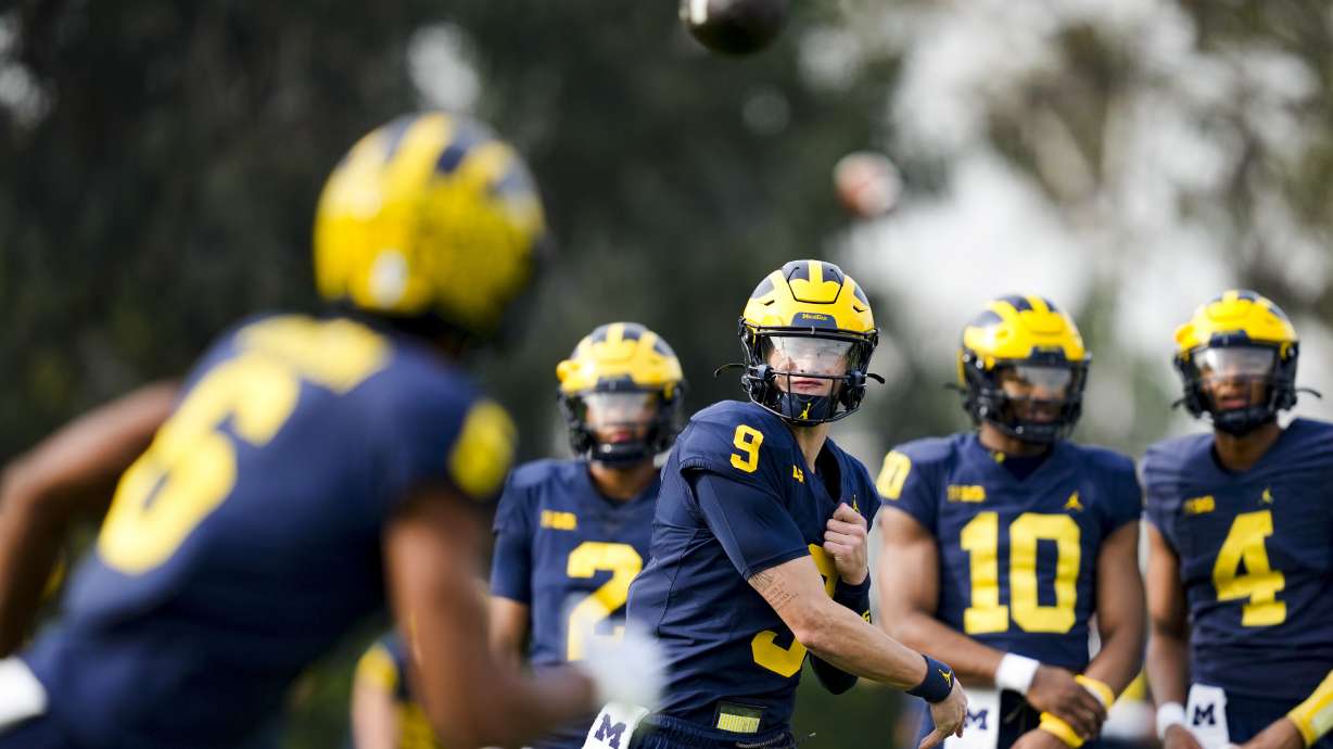 Michigan quarterback J.J. McCarthy (9) throws to wide receiver Cornelius Johnson (6) during practice Friday, Dec. 29, 2023, in Carson, Calif. Michigan is scheduled to play against Alabama on New Year's Day in the Rose Bowl, a semifinal in the College Football Playoff.