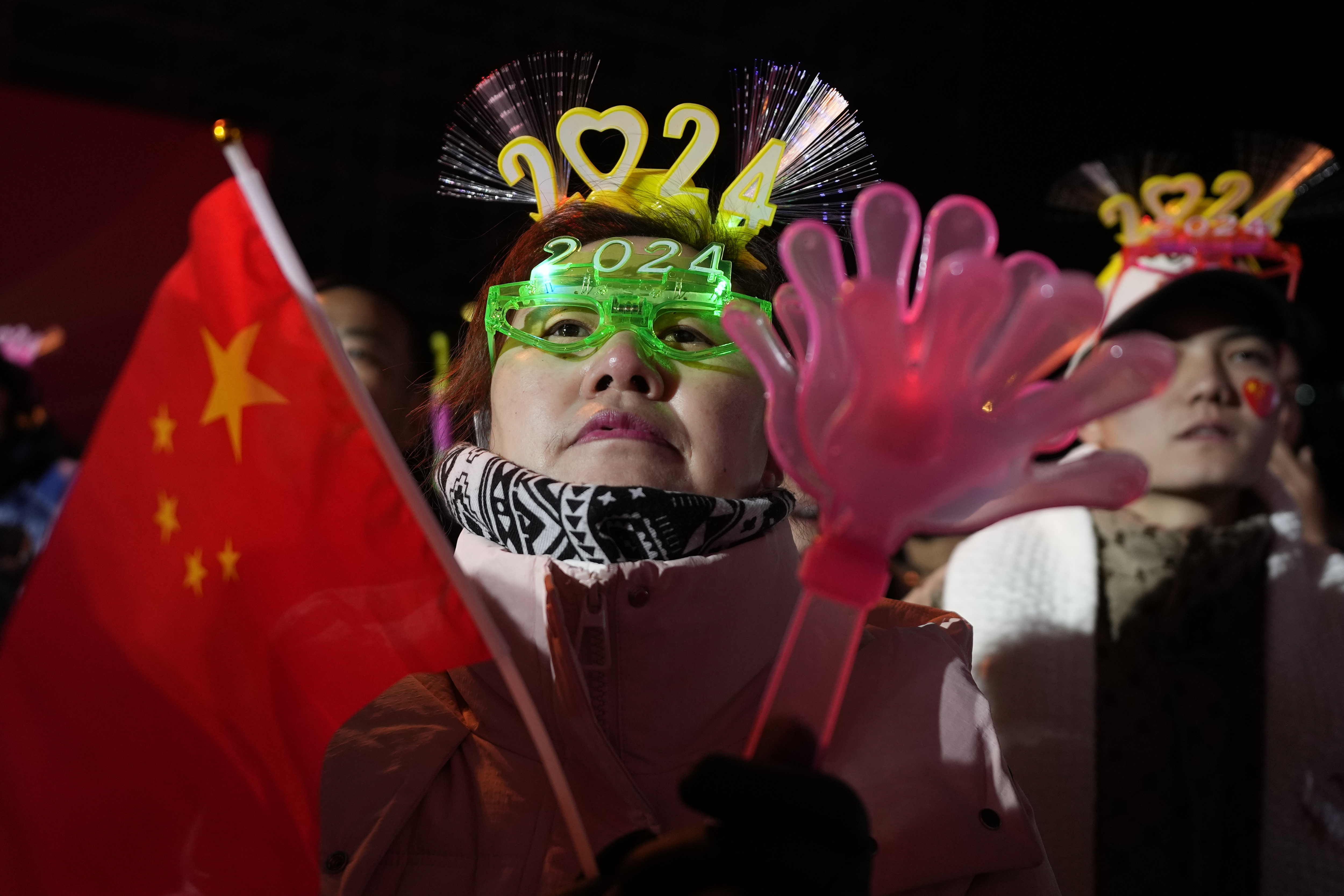 Revelers prepare for a countdown to the new year in Beijing, Sunday.