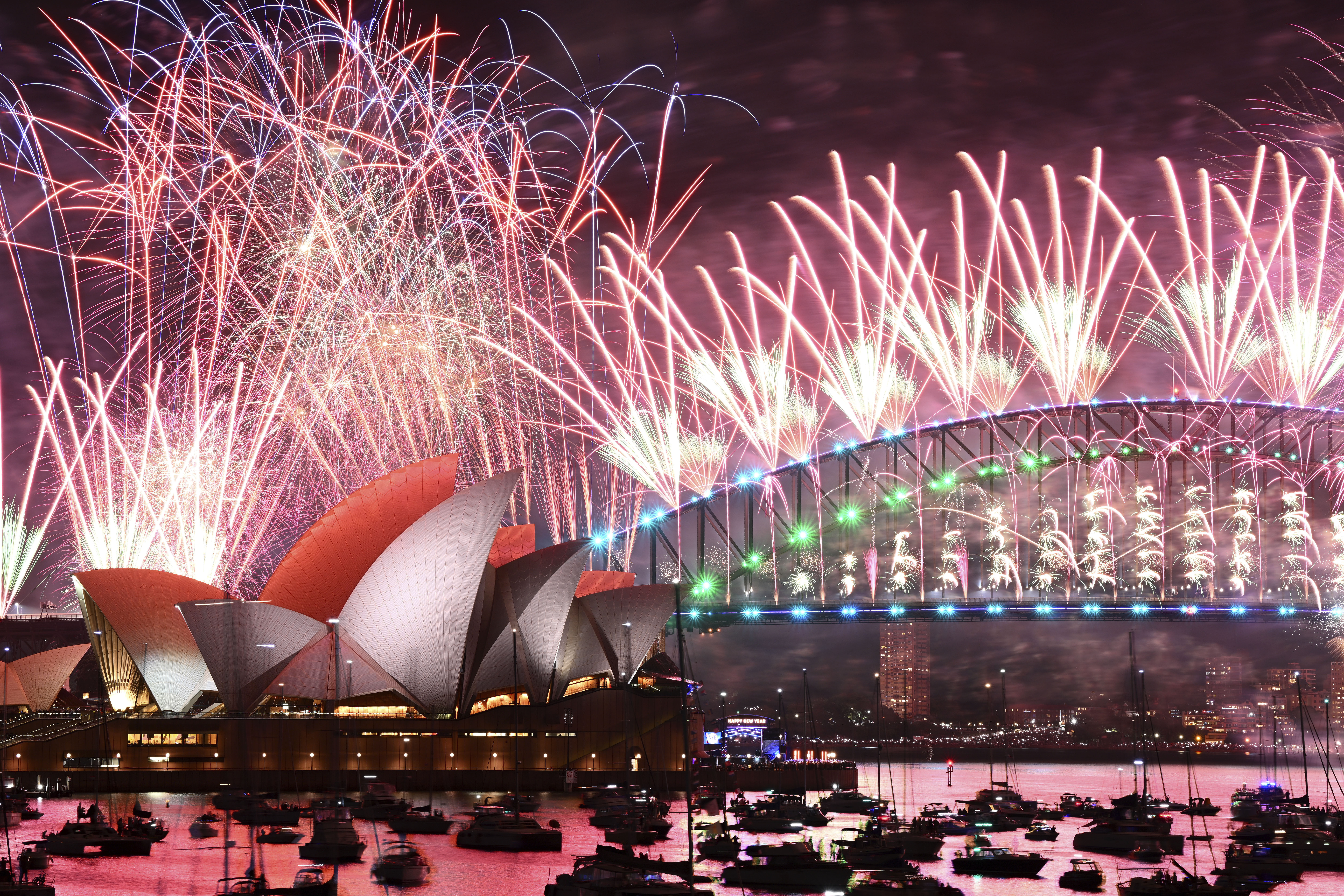 Fireworks explode over the Sydney Opera House and on the Harbour Bridge as part of New Year's Eve celebrations in Sydney, Monday, Jan. 1, 2024.