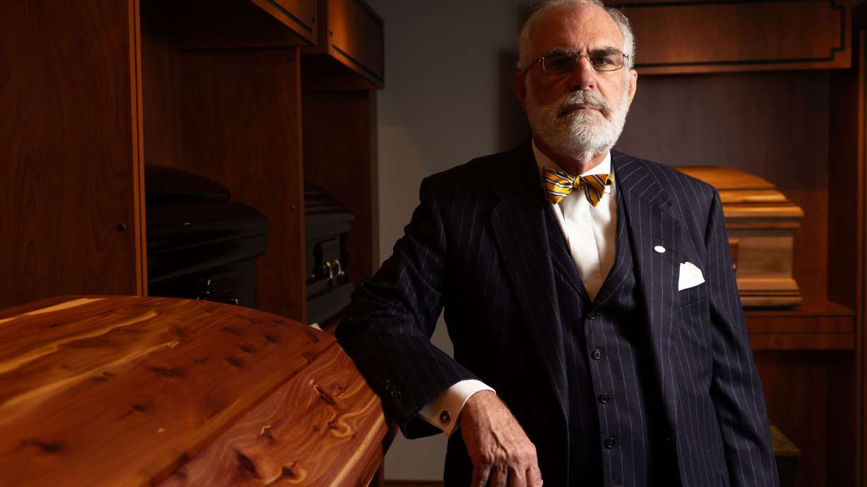 John E. Lindquist poses for a portrait at Lindquist’s Ogden Mortuary in Ogden on Dec. 11, 2023.