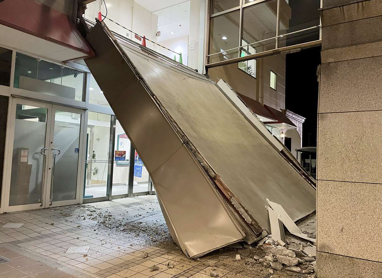 A part of a commercial facility collapses in Kaga, Ishikawa prefecture, Japan on Monday. Japan issued tsunami alerts and told people to evacuate seaside areas after a series of strong quakes on its western coastline Monday.