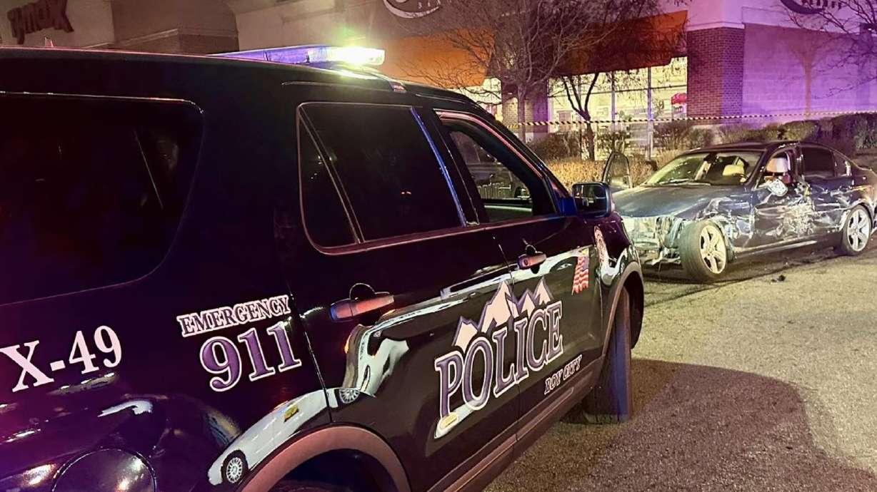 A man is in custody after authorities say he "deliberately" crashed his vehicle into a pair of squad cars during a pursuit that ended with police shooting at the vehicle Sunday night.