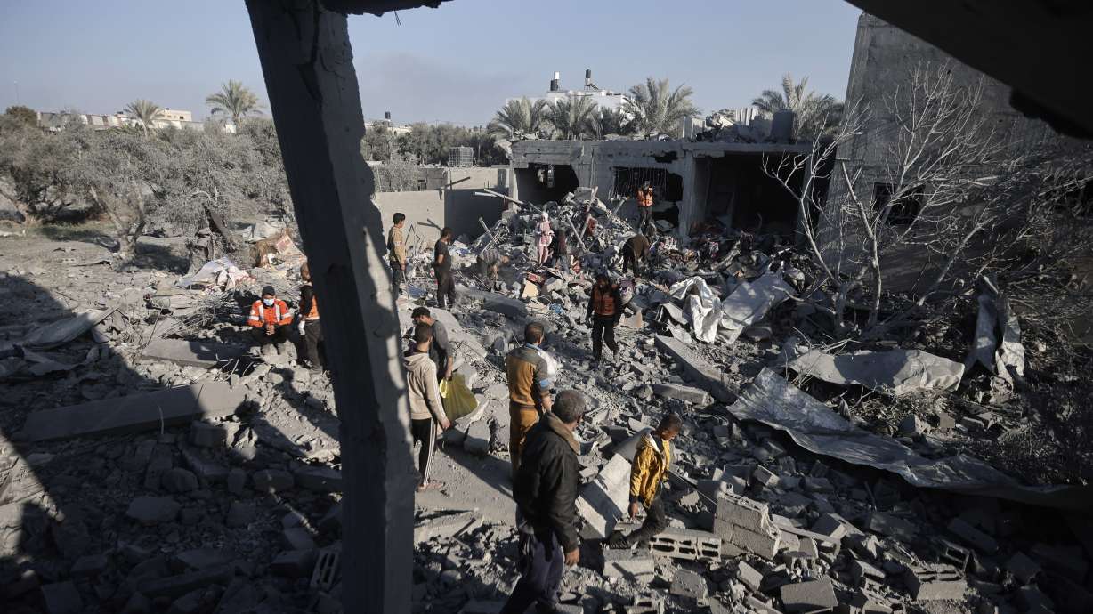 Palestinians inspect the damage of a destroyed house following Israeli airstrikes on Khan Younis, Southern Gaza Strip, Sunday. An apparent Israeli strike in the Lebanese capital of Beirut has killed Hamas' No. 2 political leader, marking a potentially significant escalation of Israel's war against the militant group and heightening the risk of a wider Middle East conflict.