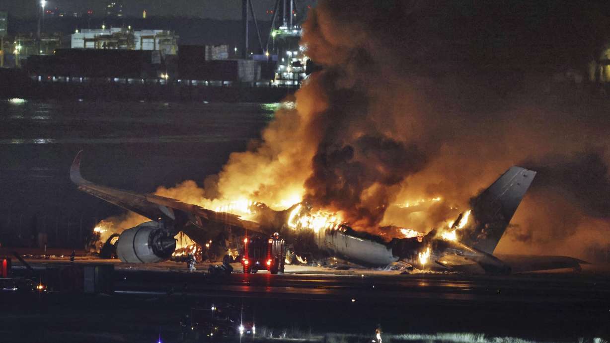 A Japan Airlines plane is on fire on the runway of Haneda airport on Tuesday in Tokyo.