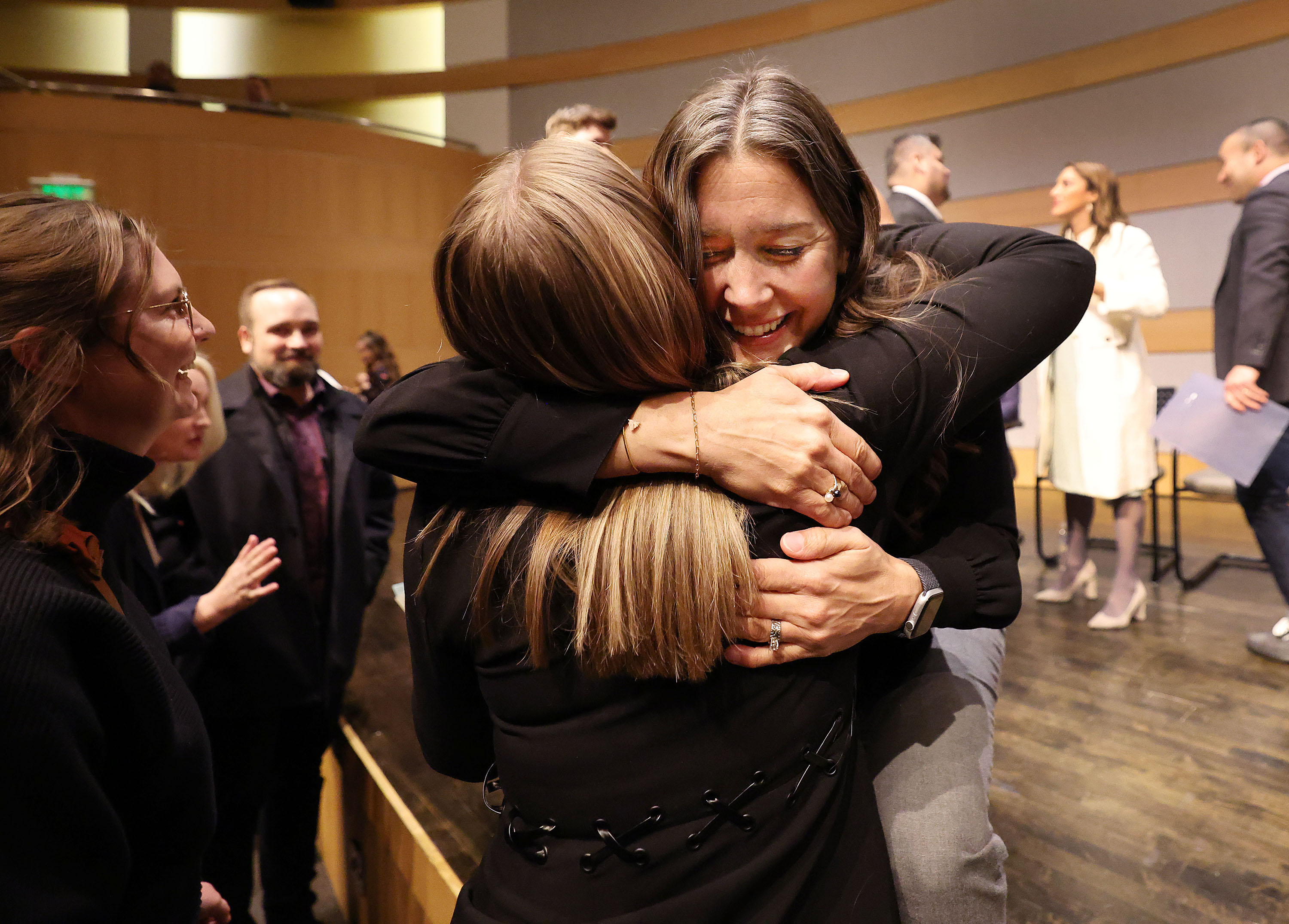 Salt Lake City Mayor Erin Mendenhall hugs Gabby Finlayson prior to taking the oath of office during her inauguration in Salt Lake City on Tuesday. Mendenhall was sworn in to her second term.