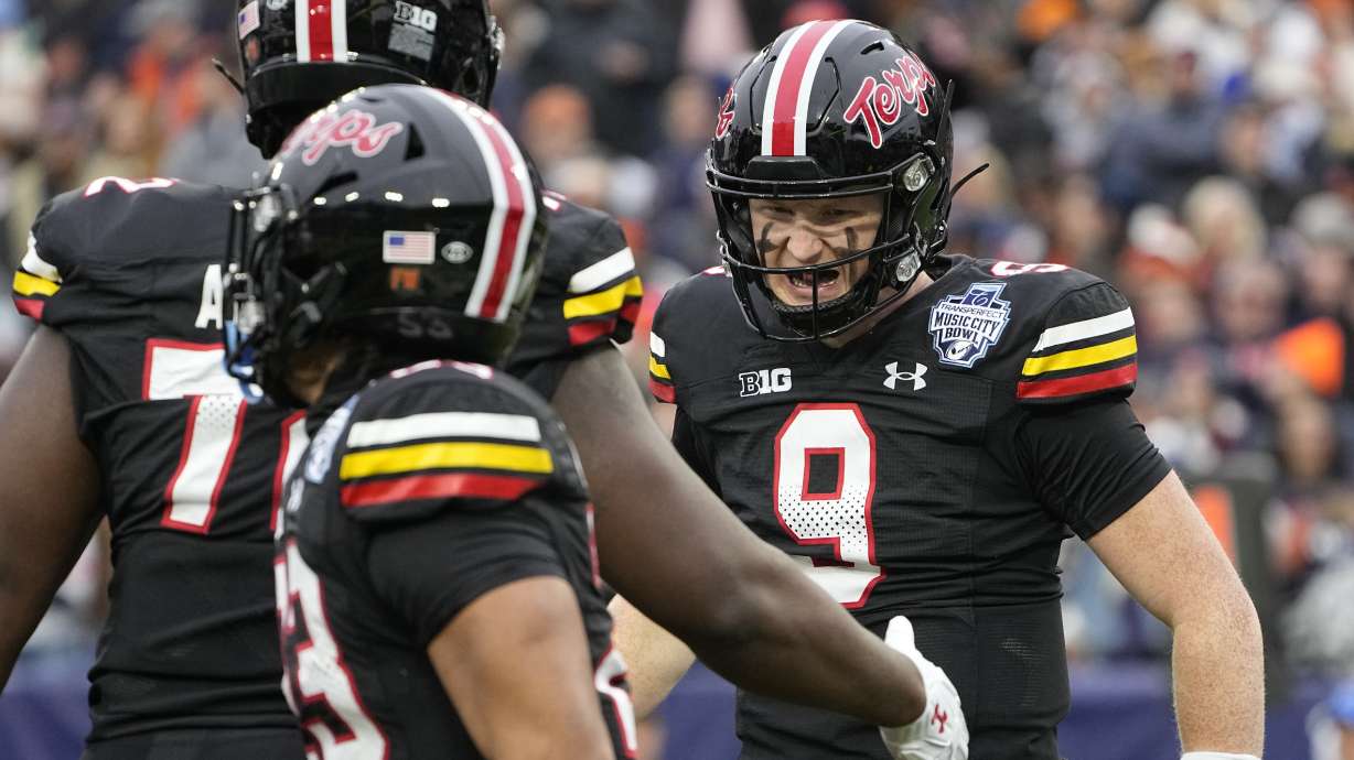 Maryland quarterback Billy Edwards Jr. (9) celebrates a touchdown with teammates during the first half of the Music City Bowl NCAA college football game against Auburn, Saturday, Dec. 30, 2023, in Nashville, Tenn.