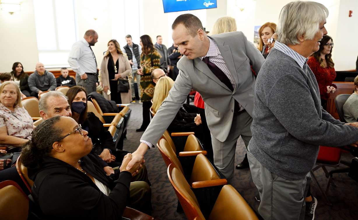 New Ogden Mayor Ben Nadolski greets friends and supporters prior to taking his oath of office along with new city council members at a ceremony in Ogden on Tuesday.