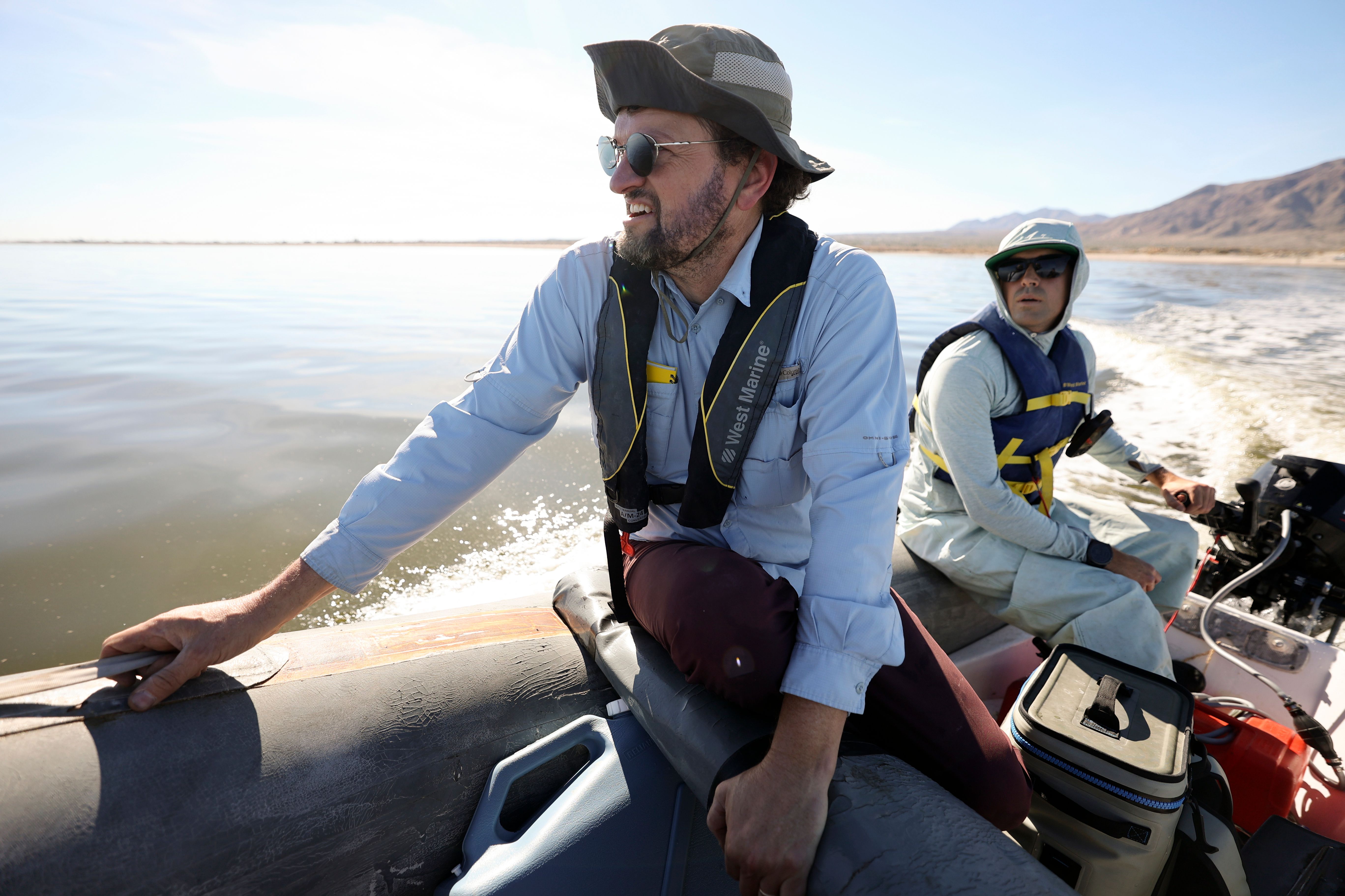 Ryan G. Sinclair and Quinn Montgomery go to various locations on the Salton Sea to collect water samples and check on a hydrogen sulfide sensor in Imperial County, Calif., on Dec. 14, 2023.