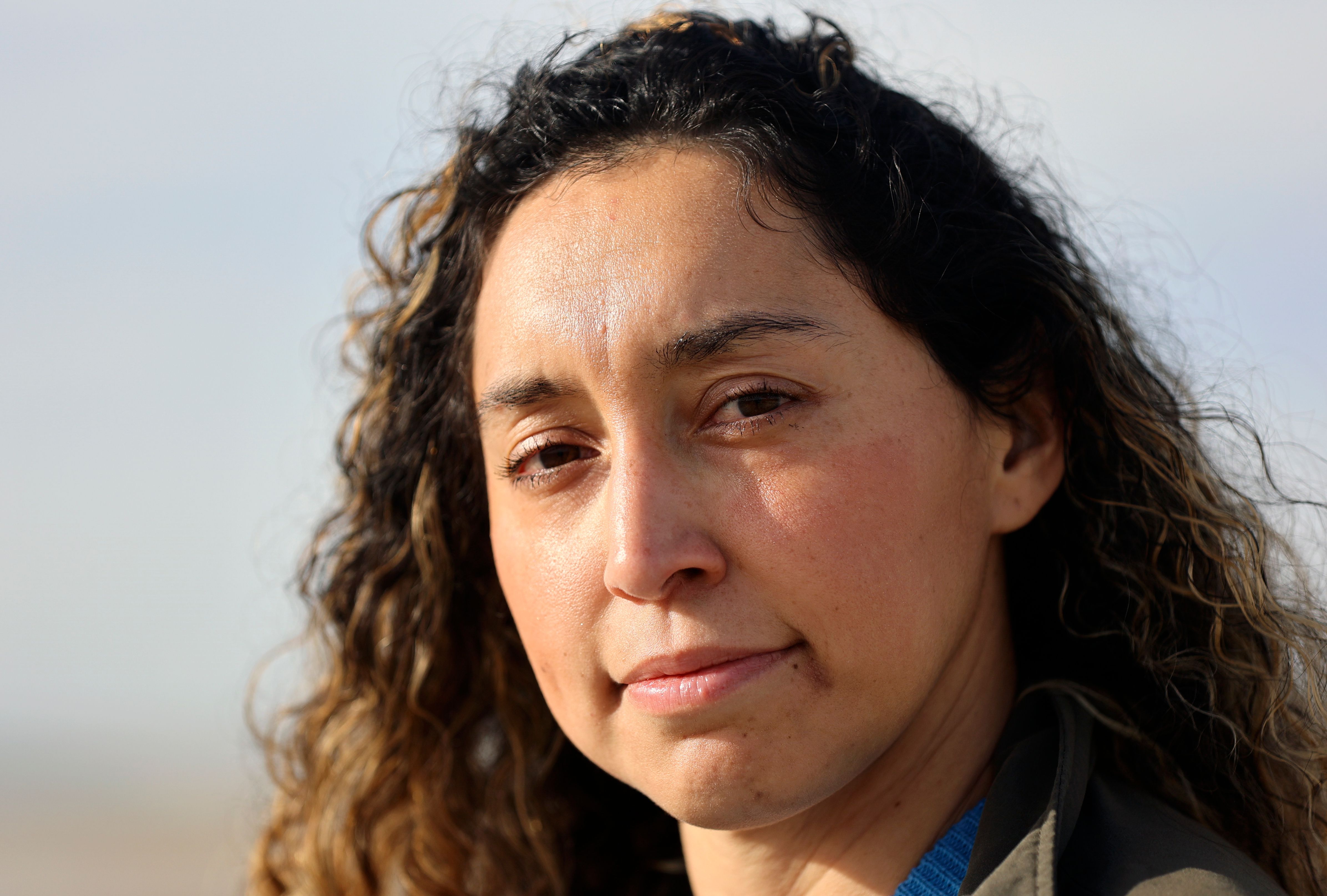 Aydee Palomino, Alianza project manager, poses for a portrait near the North Shore Beach and Yacht Club and the Salton Sea in North Shore, Calif., on Dec. 11, 2023.