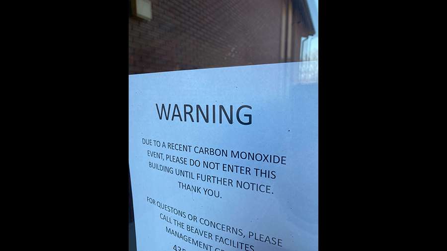 A warning sign is posted after people at a church in Monroe were exposed to carbon monoxide on Sunday, sickening more than 50 and sending many of those to area hospitals.