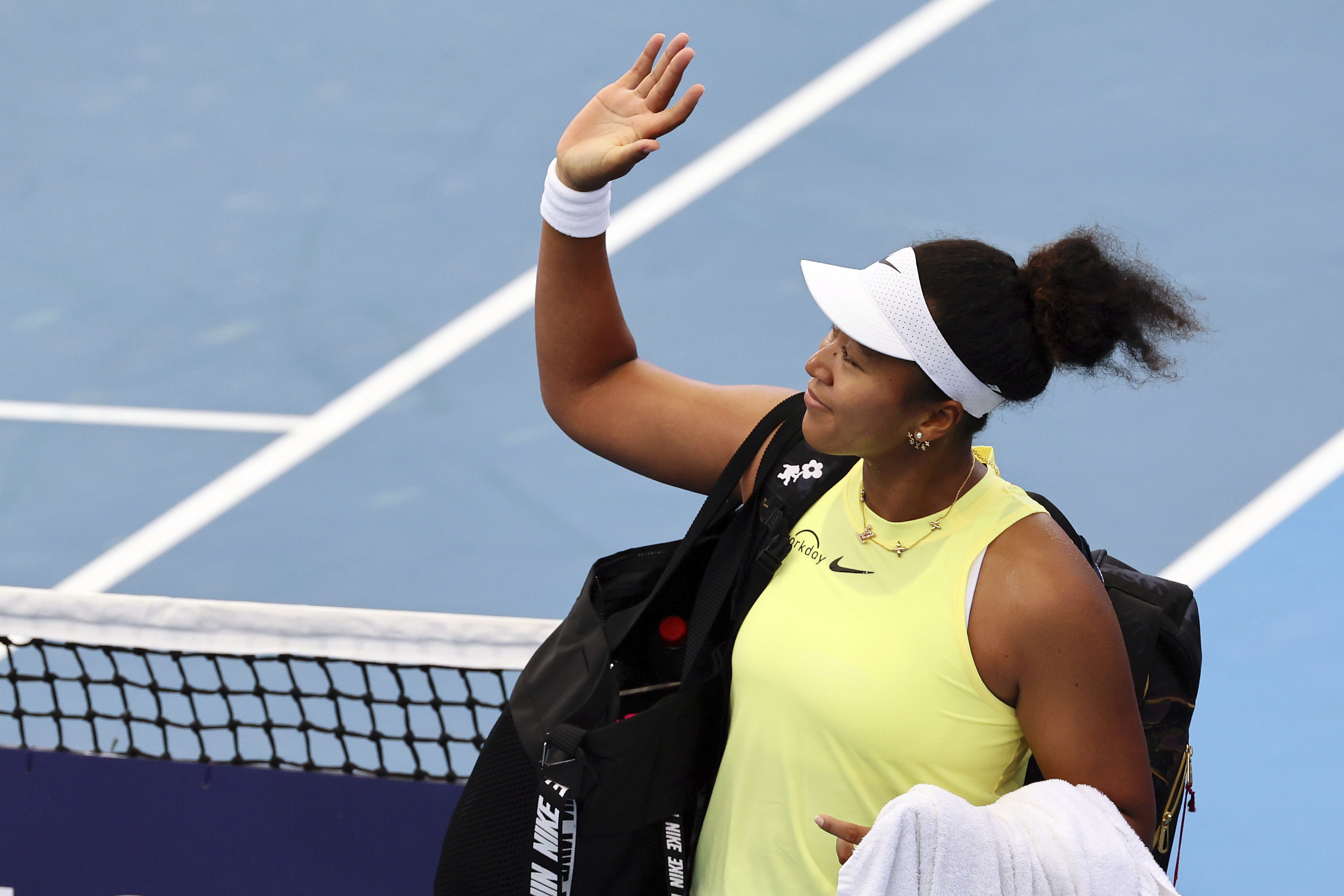 Naomi Osaka of Japan waves to the crowd after she lost her match against Karolina Pliskova of the Czech Republic during the Brisbane International tennis tournament in Brisbane, Australia, Wednesday, Jan. 3, 2024.