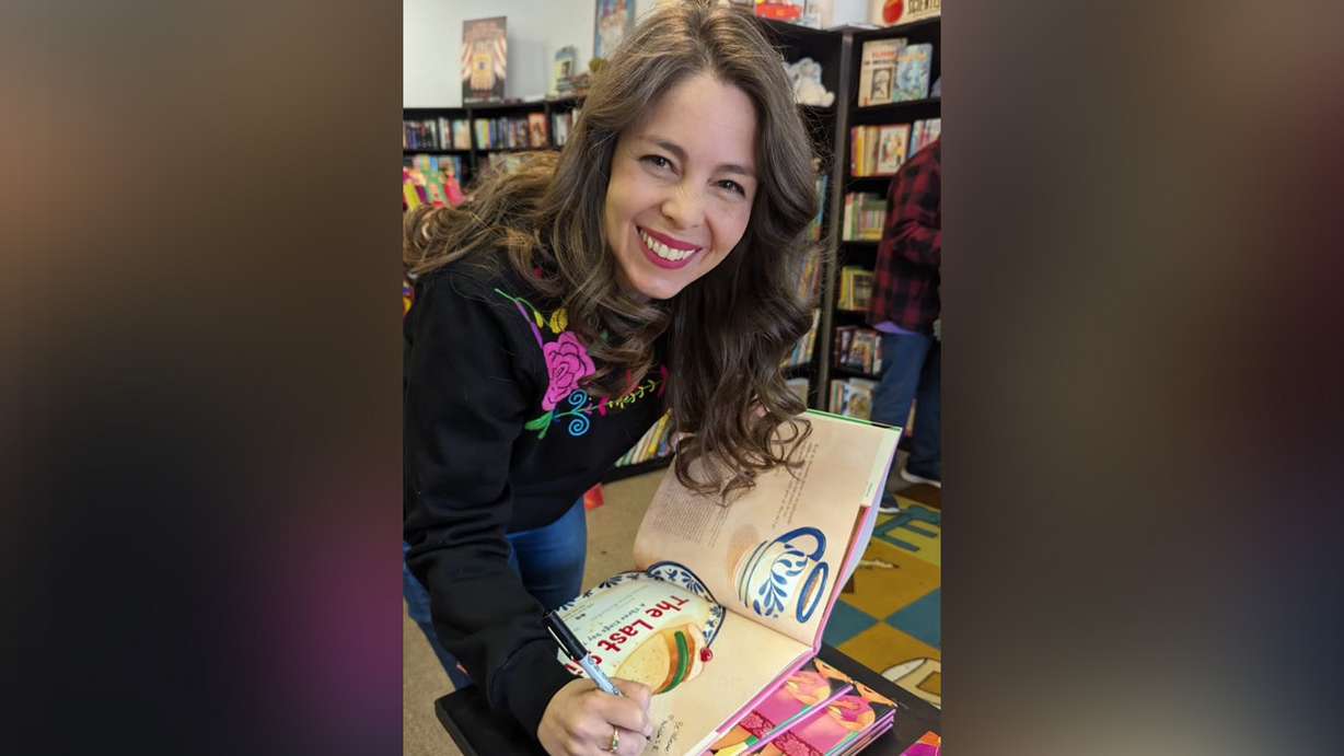 Melissa Seron Richardson, author of "The Last Slice," a book about Día de los Reyes, on Dec. 9, 2023, at the Printed Garden bookstore in Sandy. Día de los Reyes is a tradition commonly celebrated by Mexicans and those of Mexican descent.