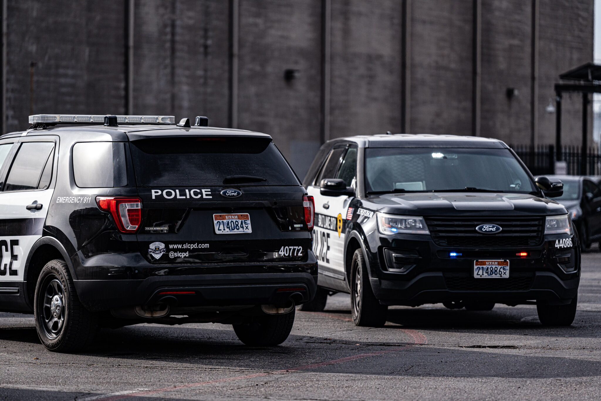 Two Salt Lake police vehicles are parked at a homicide scene at a downtown storage business, 502 W. 300 South, where a a man was found dead on Wednesday. Police have since arrested a man for investigation of murder.