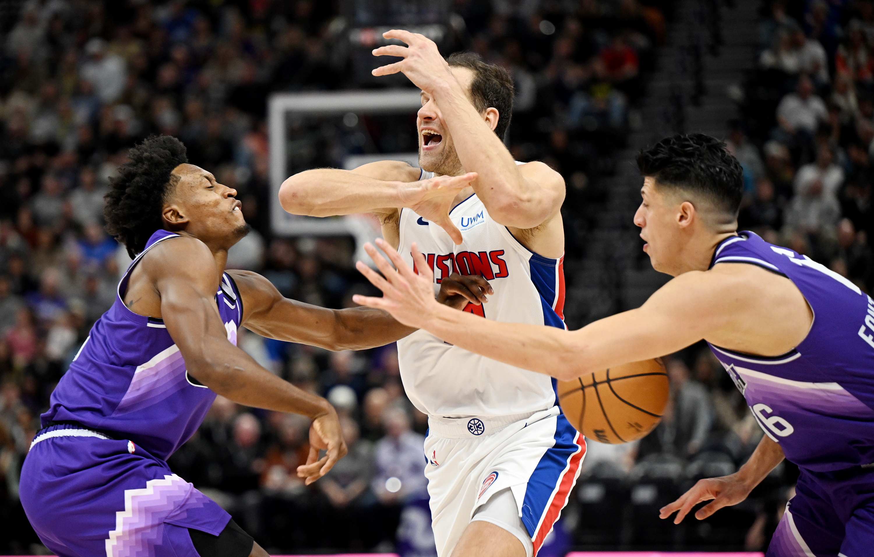 Utah Jazz guard Collin Sexton (2) and Utah Jazz forward Simone Fontecchio (16) defend Detroit Pistons forward Bojan Bogdanovic (44) as the Utah Jazz and Detroit Pistons play at the Delta Center in Salt Lake City on Wednesday, Jan. 3, 2024.