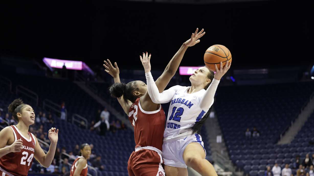 BYU forward Lauren Gustin goes up for a shot against Oklahoma, Wednesday, Jan. 3, 2024, in the Marriott in Provo. The Sooners won, 75-63.