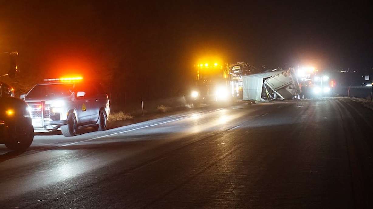 Two people died and one was injured when a car hit an overturned semitruck on northbound I-15 in Payson Thursday morning.