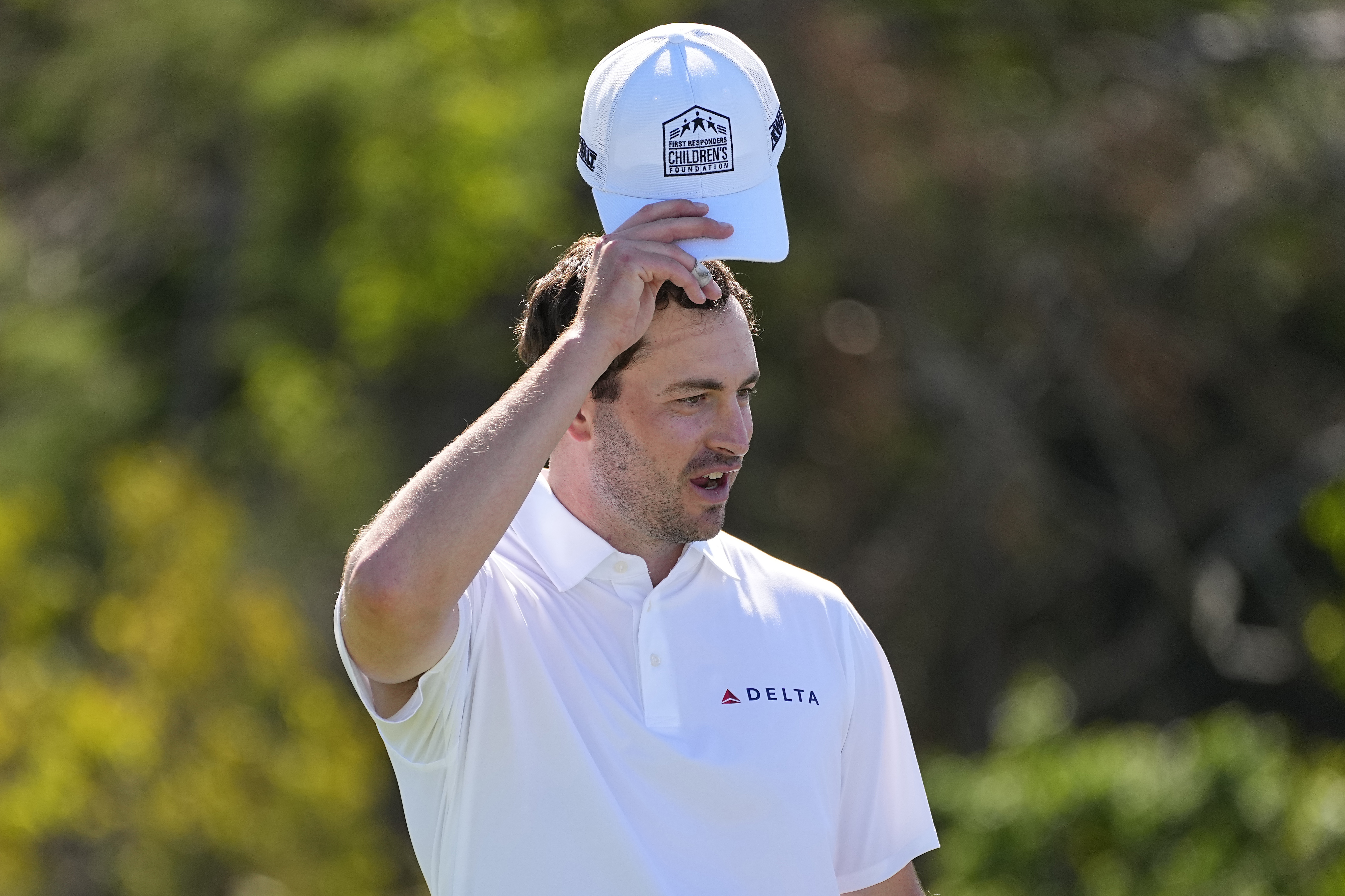 Patrick Cantlay tips his cap with the First Responders Children's Foundation logo during the pro-am round of The Sentry golf event,, Wednesday, Jan. 3, 2024, at Kapalua Plantation Course in Kapalua, Hawaii. 