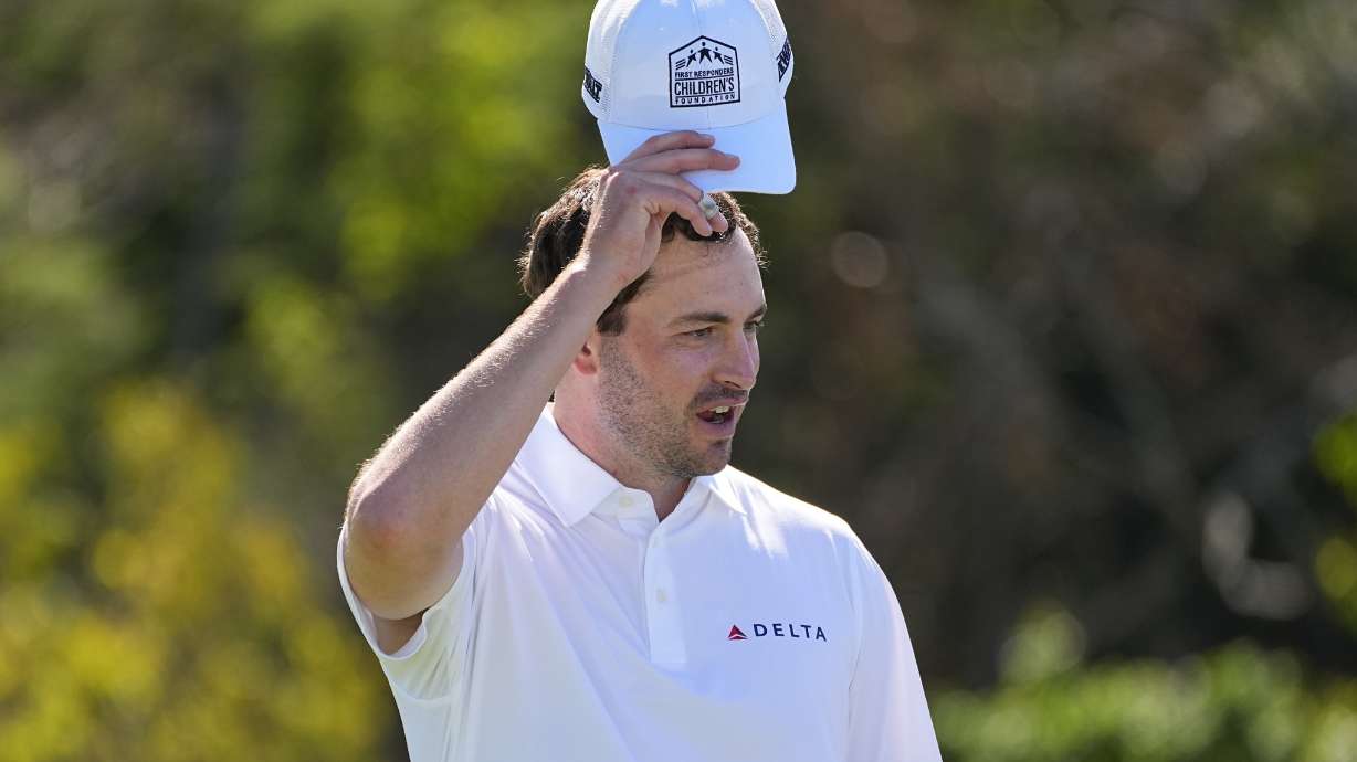 Patrick Cantlay tips his cap with the First Responders Children's Foundation logo during the pro-am round of The Sentry golf event,, Wednesday, Jan. 3, 2024, at Kapalua Plantation Course in Kapalua, Hawaii.