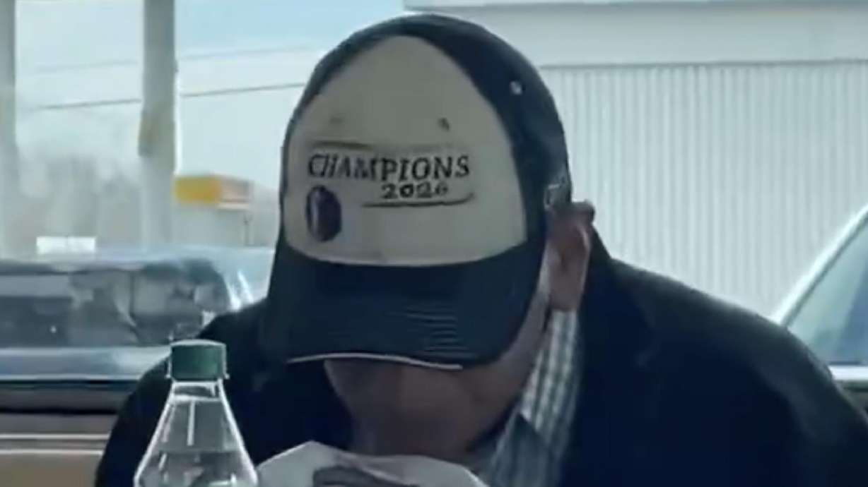A man at a restaurant wears a Dallas Mavericks "Conference Champions 2026" hat in a video captured by TikTok user therealslimshady2023.