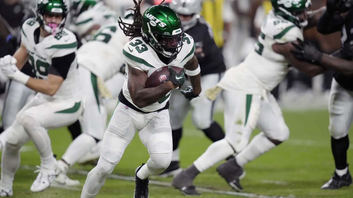 FILE - New York Jets running back Dalvin Cook carries against the Las Vegas Raiders during the first half of an NFL football game Nov. 12, 2023, in Las Vegas. Cook is joining the Baltimore Ravens for a playoff run two days after being waived by the Jets. The move, confirmed by Cook’s agents LAA Sports & Entertainment to The Associated Press on Thursday, Jan. 4, came after Cook cleared waivers and became a free agent.