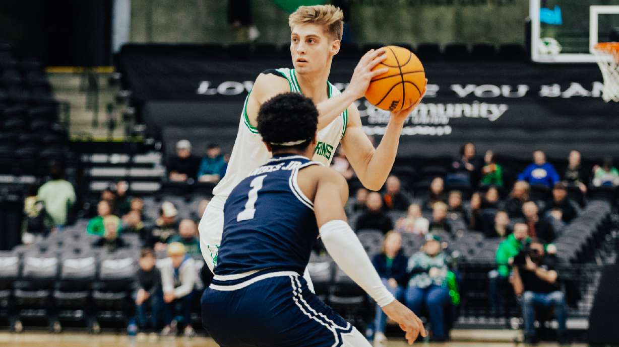 UVU guard Tanner Toolson looks to pass against California Baptist, Thursday, Jan. 4, 2024 during a WAC men's basketball game at the UCCU Center.
