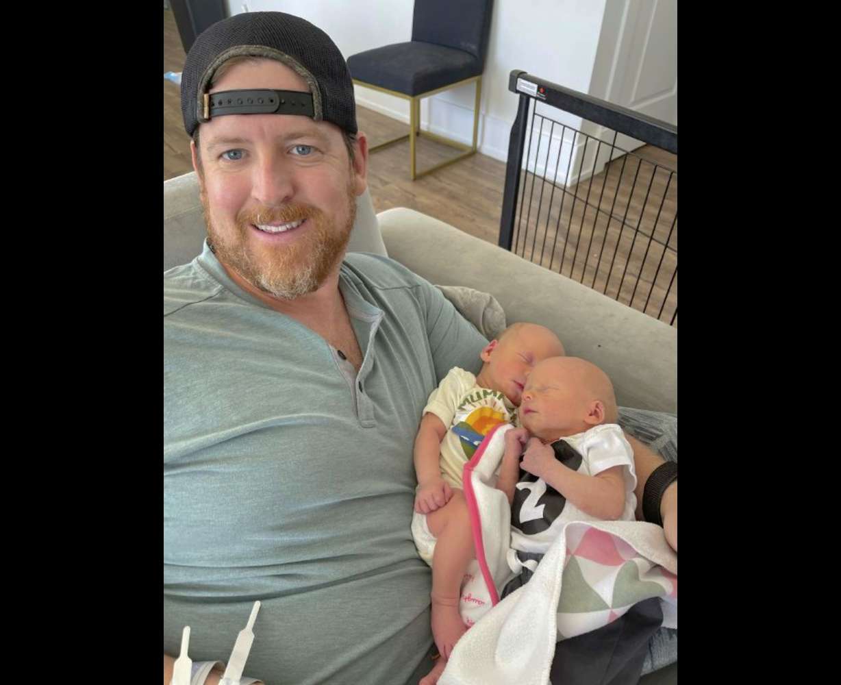 In this family photo, Justin Fell, of Bel Air, Md., holds his twin sons, Hayden, left, and Cameron. The last bedtime of 17-month-old Hayden's life was heartbreakingly normal. Crib video shows the toddler in pajamas playing happily as his parents and sister sang “Wheels on the Bus” with his twin brother. The next morning, Hayden’s dad couldn’t wake him.