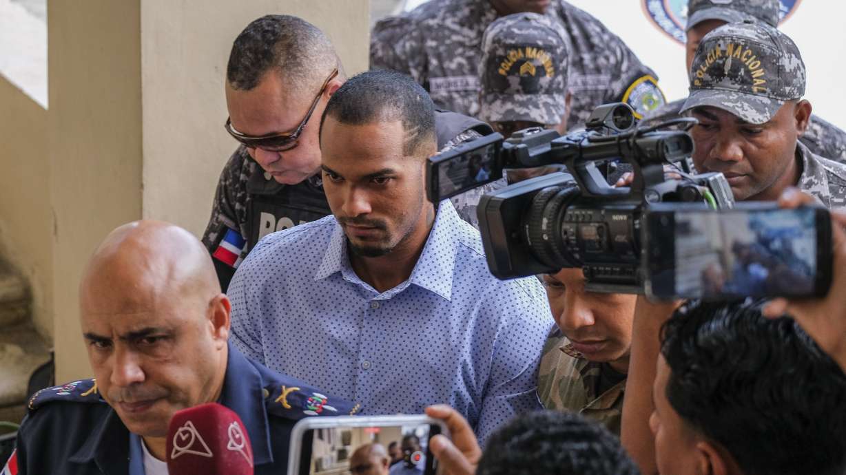 Tampa Bay Rays shortstop Wander Franco, center, is escorted by police to court in Puerto Plata, Dominican Republic Friday, Jan. 5, 2024. Dominican prosecutors on Wednesday accused Franco of commercial sexual exploitation and money laundering following allegations that he had a relationship with a minor whose mother also faces the same charges.