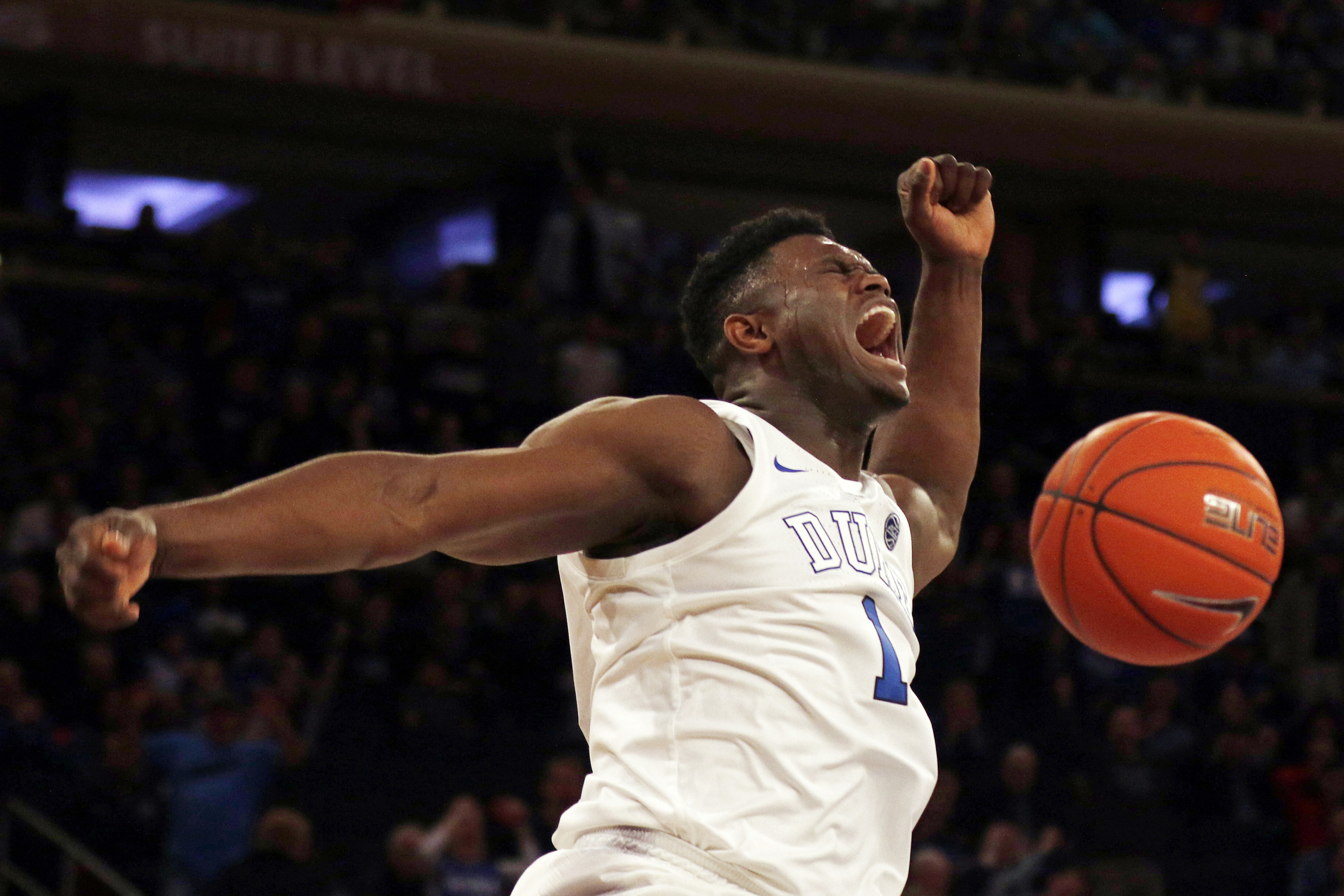 FILE - Duke forward Zion Williamson (1) reacts after a dunk against Texas Tech during the first half of an NCAA college basketball game in New York, Dec. 20, 2018. 