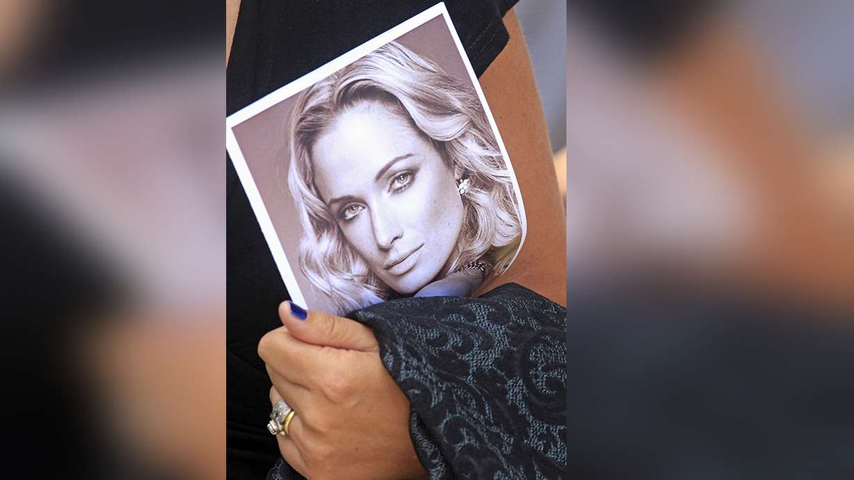 A mourner carries a program at the funeral for Reeva Steenkamp, in Port Elizabeth, South Africa on Feb. 19, 2013. Oscar Pistorius was released from prison Friday after serving nearly nine years for the shooting death of girlfriend Reeva Steenkamp.