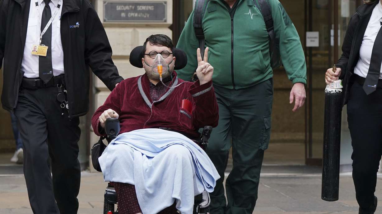 Nicholas Rossi leaves court after an extradition hearing, in Edinburgh, July 12, 2022. Rossi, who is accused of faking his death to avoid a rape charge in Utah, has been extradited from Scotland to the U.S., British news media reported Friday.