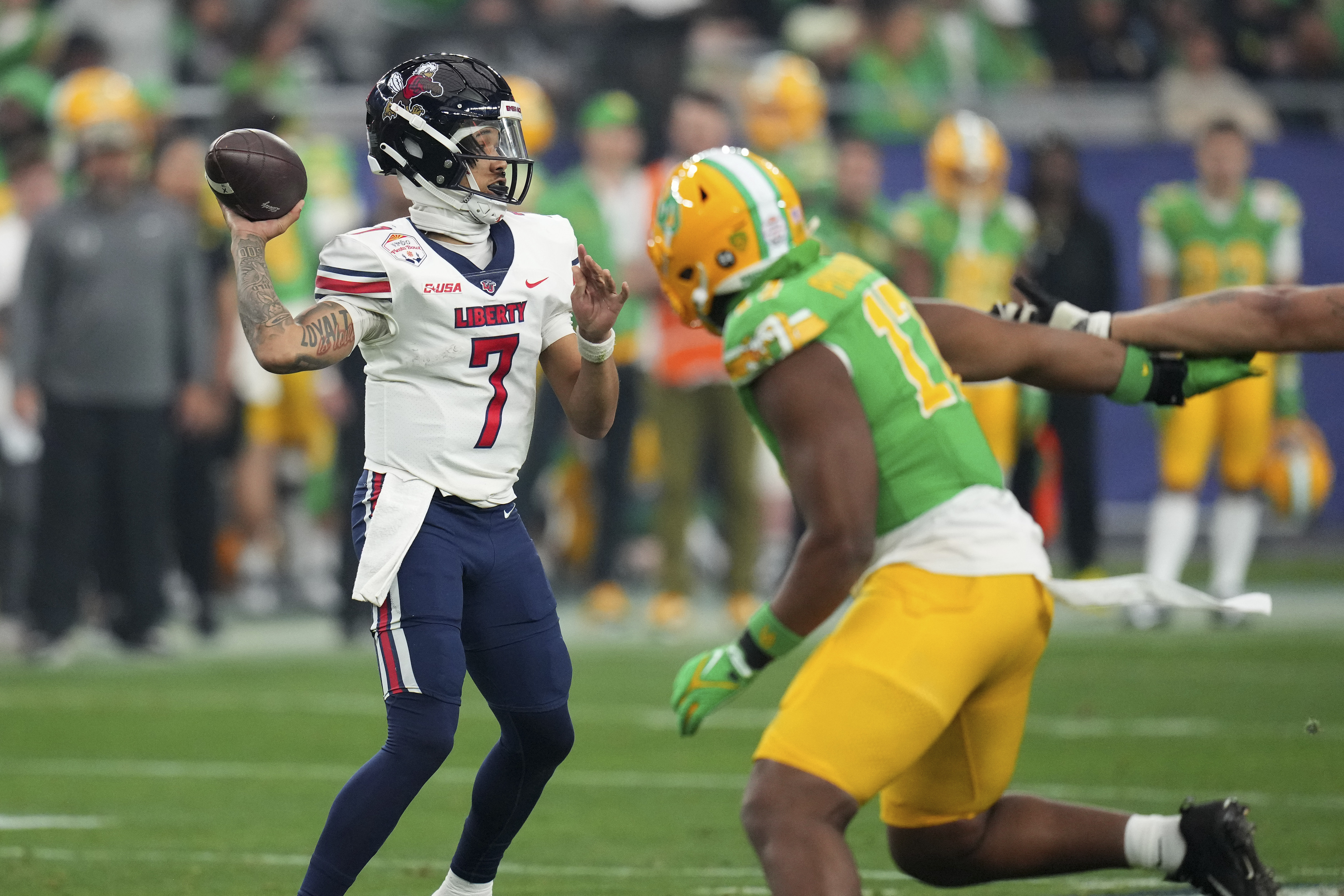 Liberty quarterback Kaidon Salter (7) throws against Oregon during the first half on the NCAA Fiesta Bowl college football game, Monday, Jan. 1, 2024, in Glendale, Ariz.