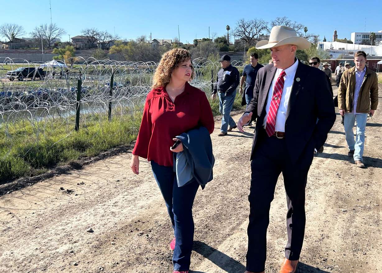 Utah 3rd District Rep. Celeste Maloy, R-Utah, walks with Gollad County, Texas, Sheriff Roy Boyd at the border in Eagle Pass, Texas, on Wednesday.