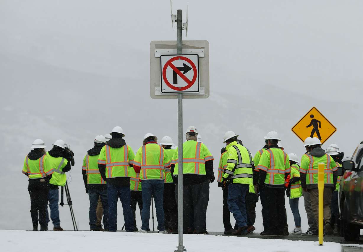 Elected officials and media look over the new West Davis Highway in Davis County on Friday. The new 16-mile, four-lane divided highway runs from I-15 near Glovers Lane in Farmington to West Point.