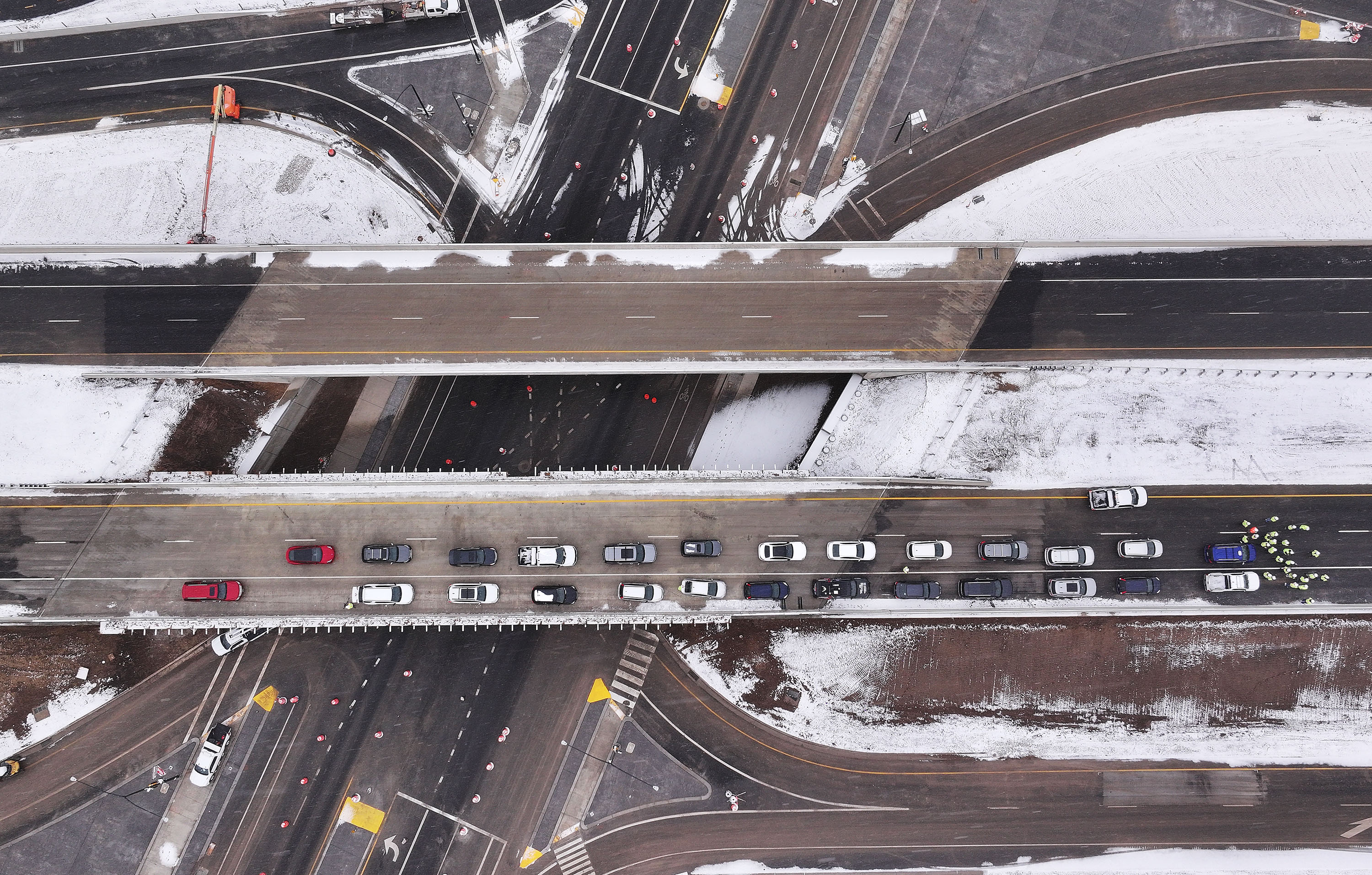 Elected officials and media look over the new West Davis Highway as it crosses Antelope Drive in Davis County on Friday. The new 16-mile, four-lane divided highway runs from I-15 near Glovers Lane in Farmington to West Point.