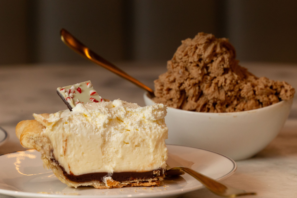 A peppermint pie from Grapefruit & Thyme and a bowl of Eleanor's Coconut Cream are plated for a photo at The Dessert Collective in American Fork on Jan. 2.