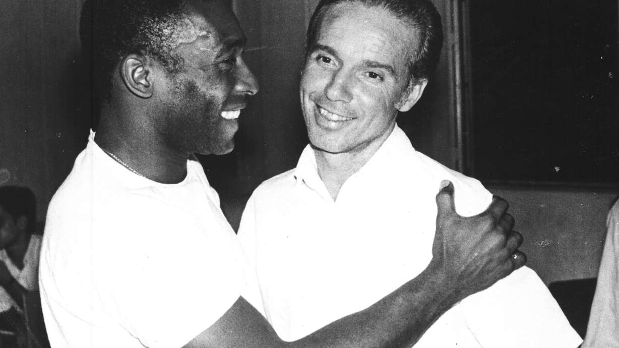 FILE - Brazil's soccer star Pele, left, embraces Mario Zagallo after the latter's appointment as coach of the Brazilian national soccer team, in Rio De Janeiro, Brazil, in March 1970. Zagallo, who reached the World Cup final a record five times, winning four, as a player and then a coach with Brazil, has died. He was 92. Brazilian soccer confederation president Ednaldo Rodrigues said in a statement in the early hours of Saturday, Jan. 5, 2024, confirming Zagallo's death that Zagallo "is one of the biggest legends" of the sport.