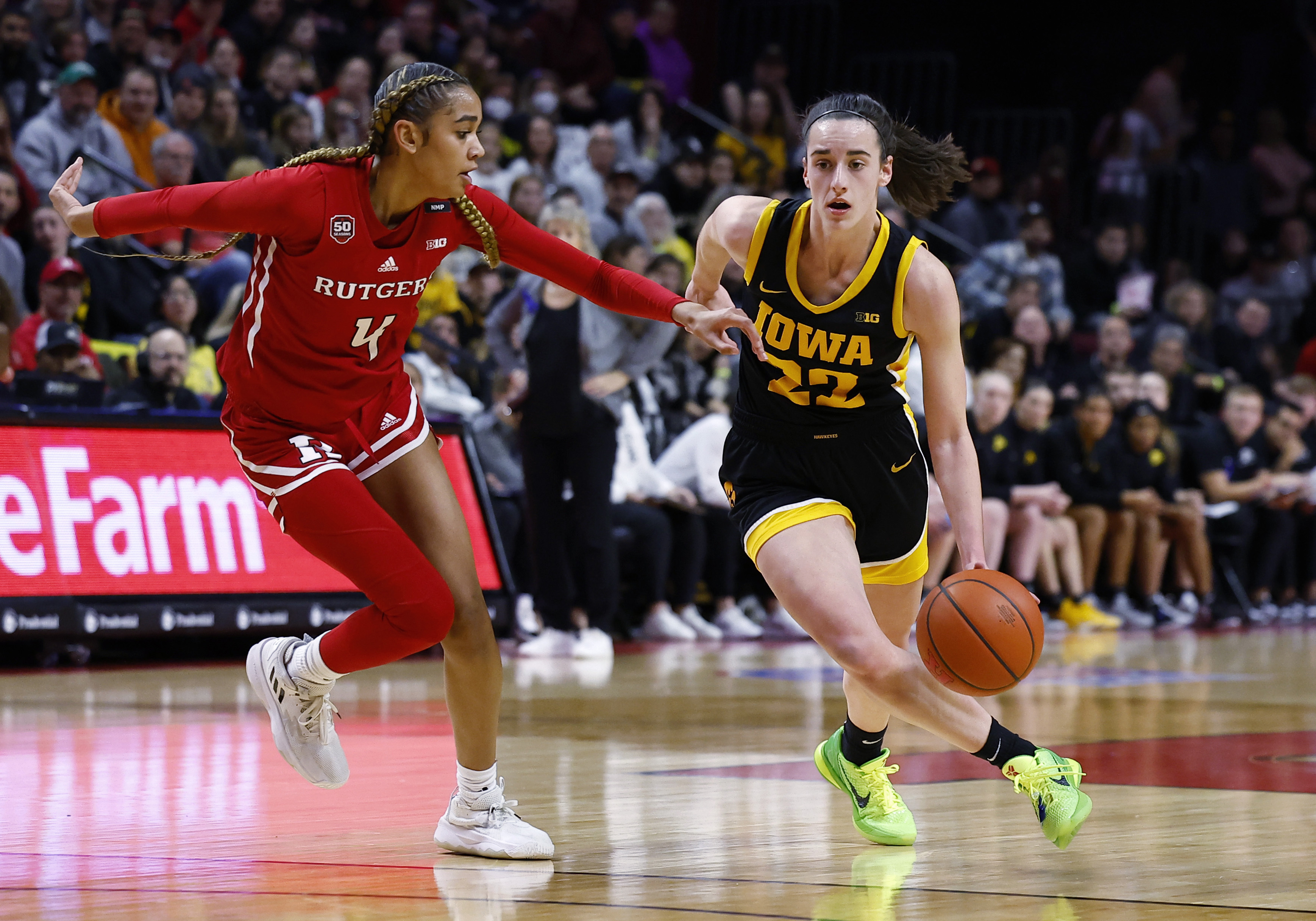 Iowa guard Caitlin Clark (22) drives to the basket against Rutgers guard Antonia Bates (4) during the first half of an NCAA college basketball game Friday, Jan. 5, 2024, in Piscataway, N.J. 