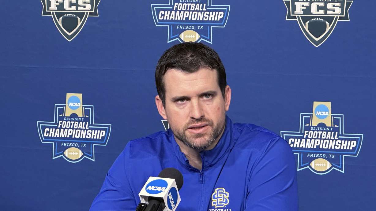 South Dakota State first-year coach Jimmy Rogers talks to the media Friday, Jan. 5, 2024, in Frisco, Texas, in advance of the NCAA Football Championship Subdivision title game. Top-seeded and undefeated SDSU has won 28 games in a row. Rogers, a former Jackrabbits player, was their defensive coordinator last year when they won their first FCS title in veteran coach John Stiegelmeier’s final game. South Dakota State plays against Montana on Sunday.