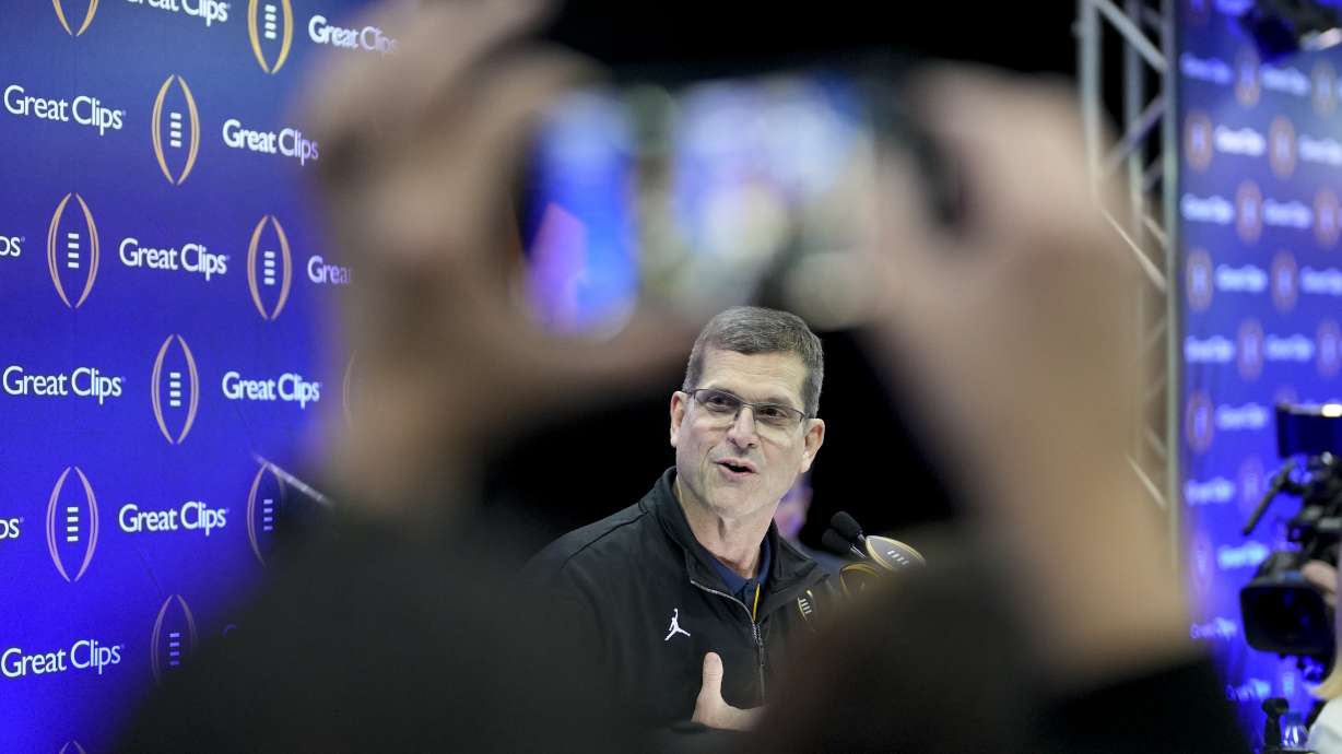 Michigan head coach Jim Harbaugh is interviewed during media day ahead of the national championship NCAA College Football Playoff game between Washington and Michigan Saturday, Jan. 6, 2024, in Houston. The game will played Monday.