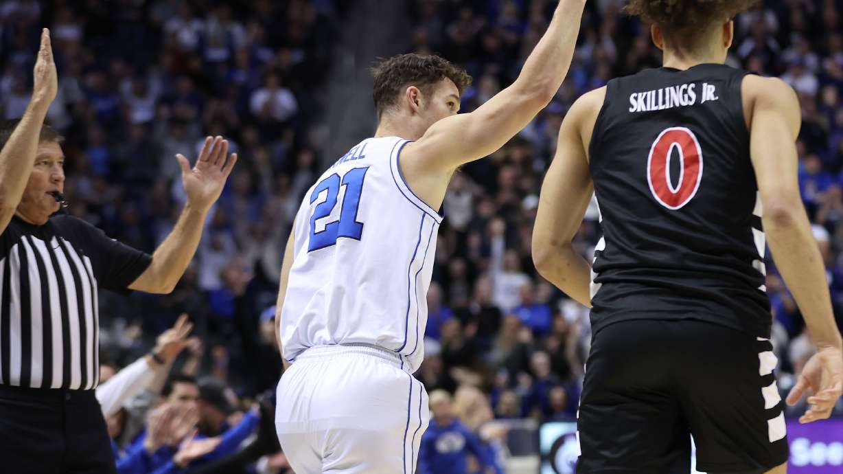 Brigham Young guard Trevin Knell (21) hits a 3-pointer against the Cincinnati Bearcats in Provo on Saturday, Jan. 6, 2024. Cincinnati won 71-60.