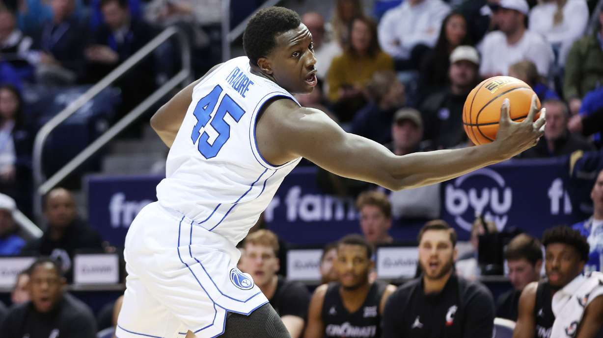 Brigham Young Cougars forward Fousseyni Traore (45) grabs a rebound in Provo on Saturday, Jan. 6, 2024. Cincinnati won 71-60.