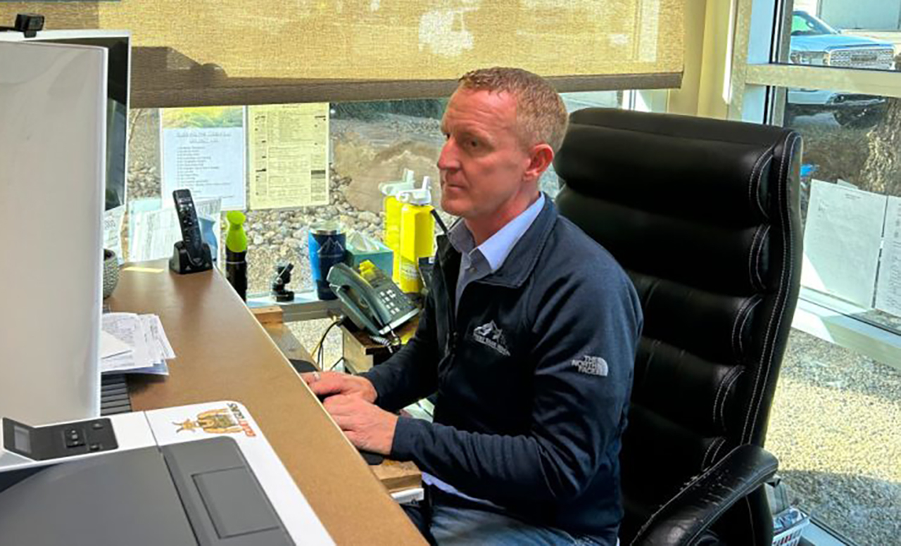 Ryan Borrowman scans over his documents in St. George Friday. Borrowman, a nurse, helped save a woman's life after a car crash in southern Utah on Dec. 16, 2023.